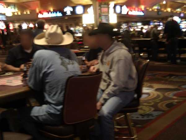 A few cowboys playing roulette