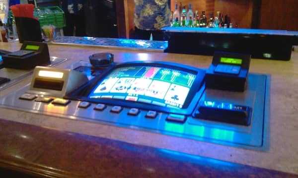 A slot machine located at a bar