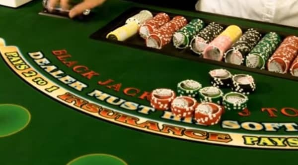 The dealer hands the cut card to the player on a single deck game