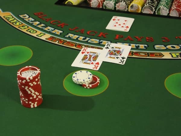 A blackjack bet that has two dollars heeled on top of it