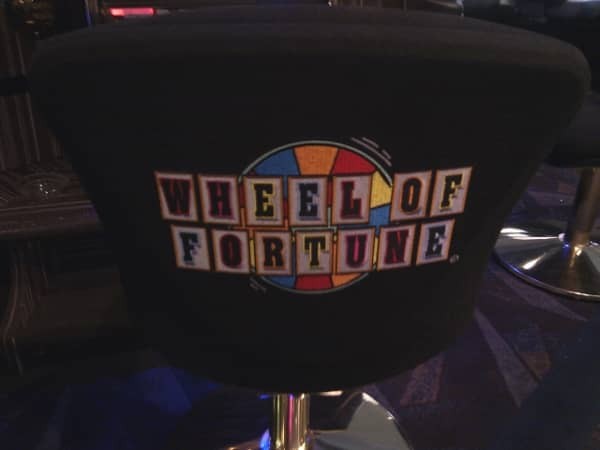 The Wheel of Fortune logo on the back of a chair