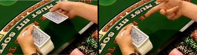 The dealer uses the middle finger to flip the card