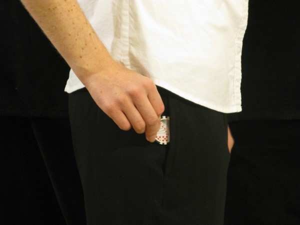 The dealer is putting a black chip in their pocket
