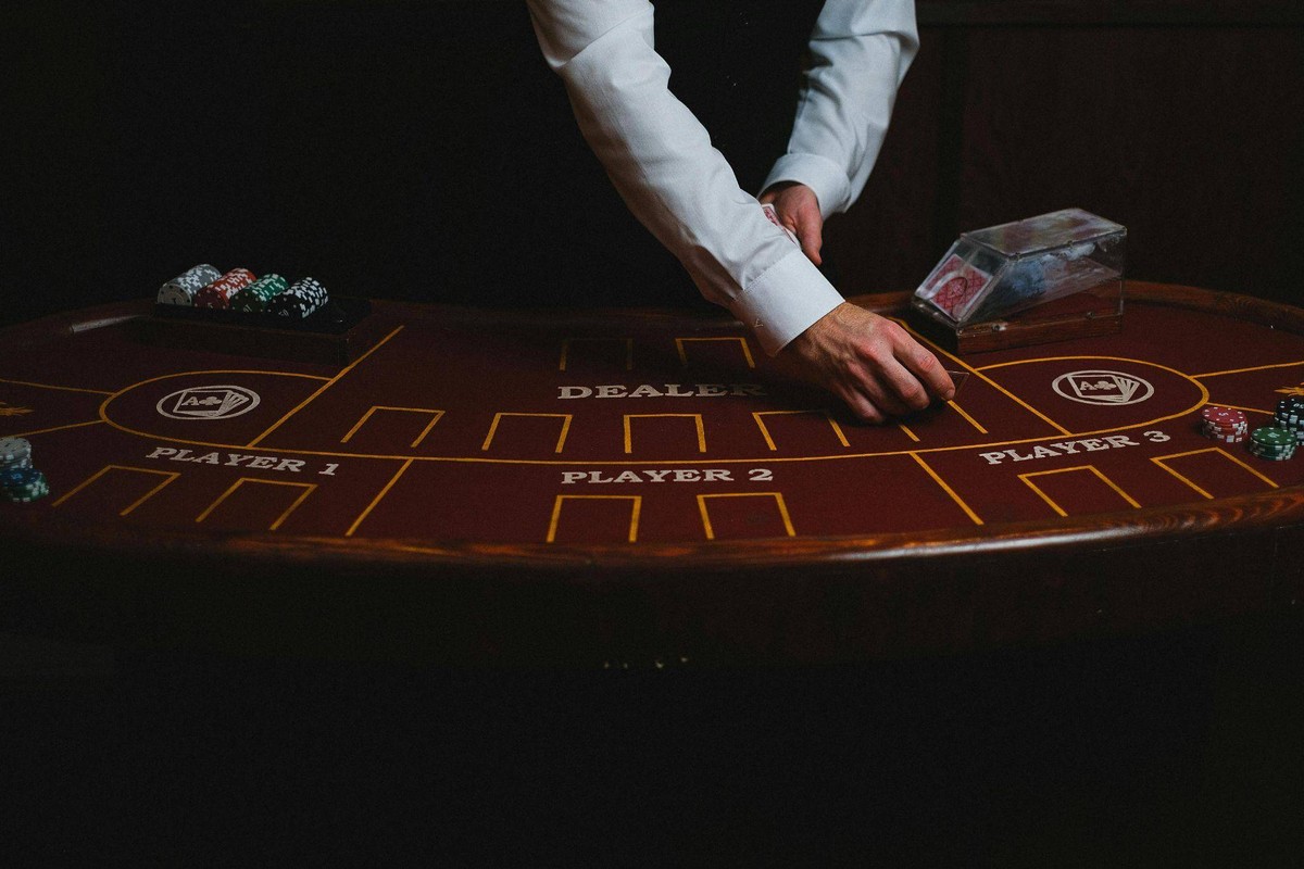 croupier with cards in casino