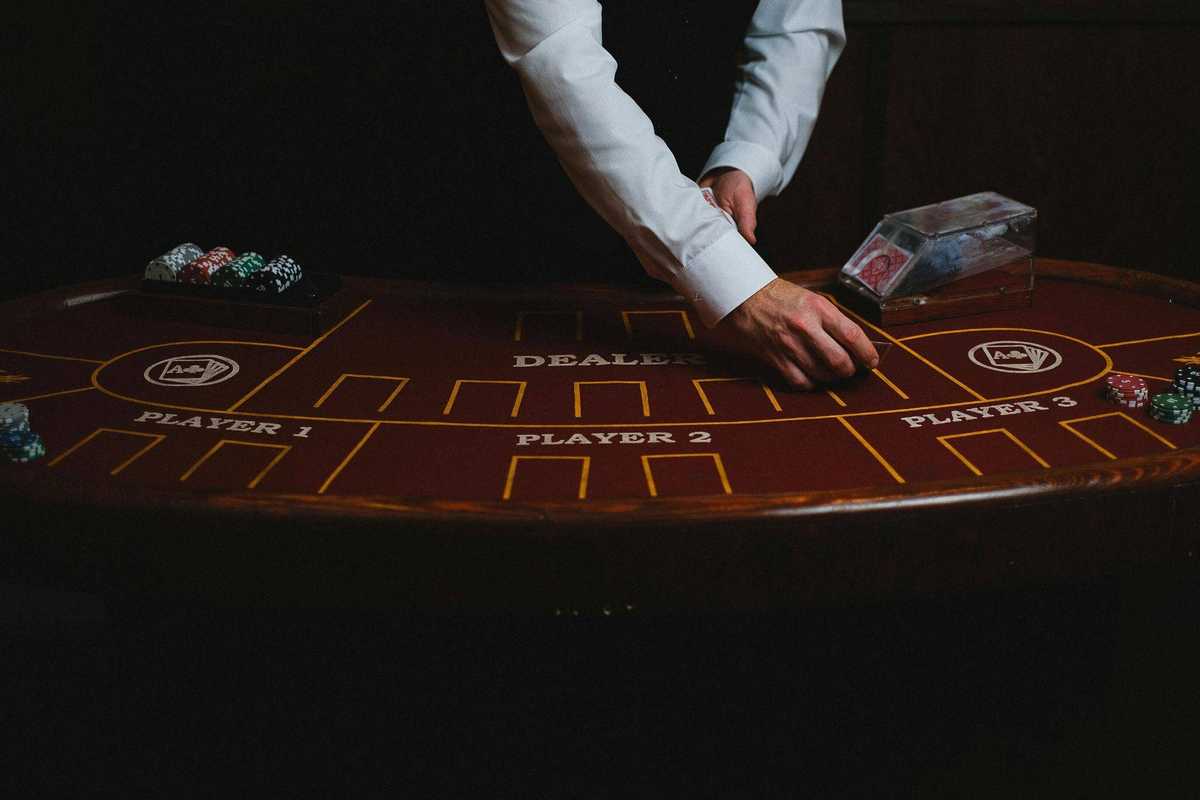 croupier with cards in casino