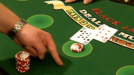 Player is using hand signals for surrender Player is using hand signals for surrender