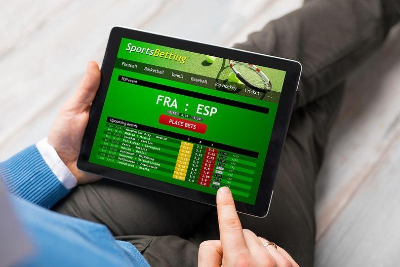 Player betting on sports on a tablet