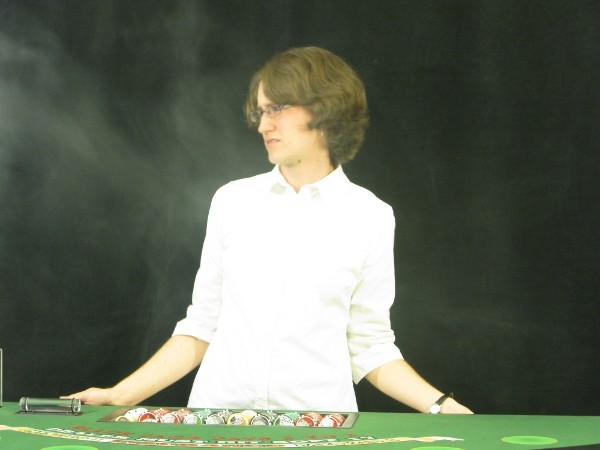 The player is blowing smoke in the dealers face