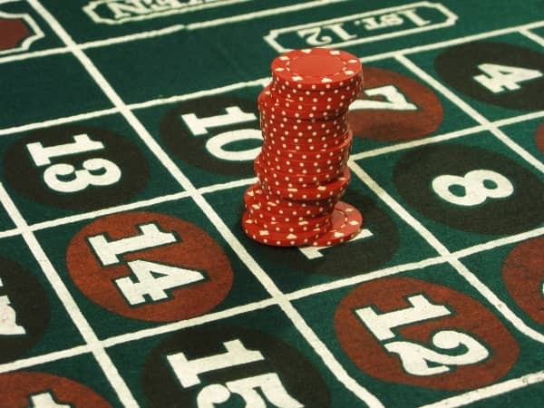 A large stack of chips is on one number on roulette